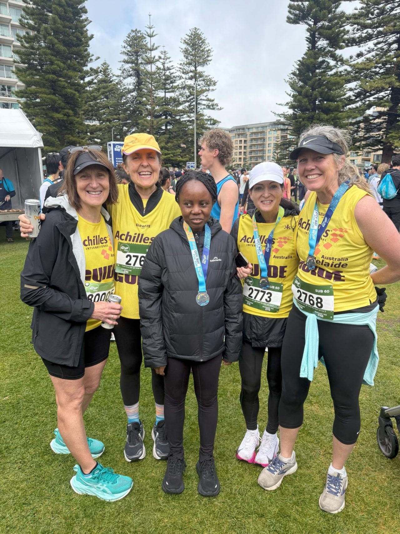 Leonie, Angela, Pelgrina, Megan and Susan together wearing medals