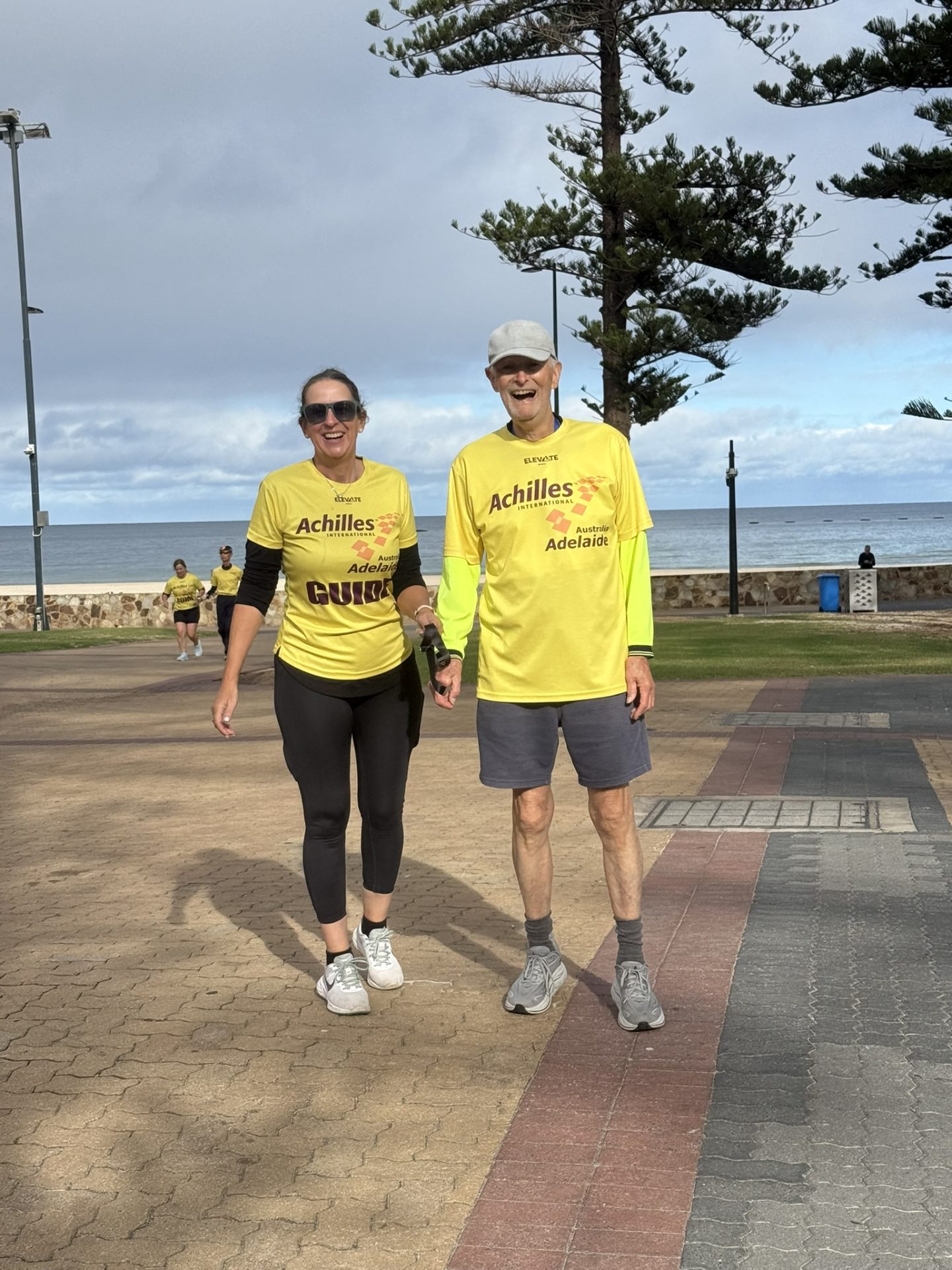 Karyn and Tony walking at Glenelg