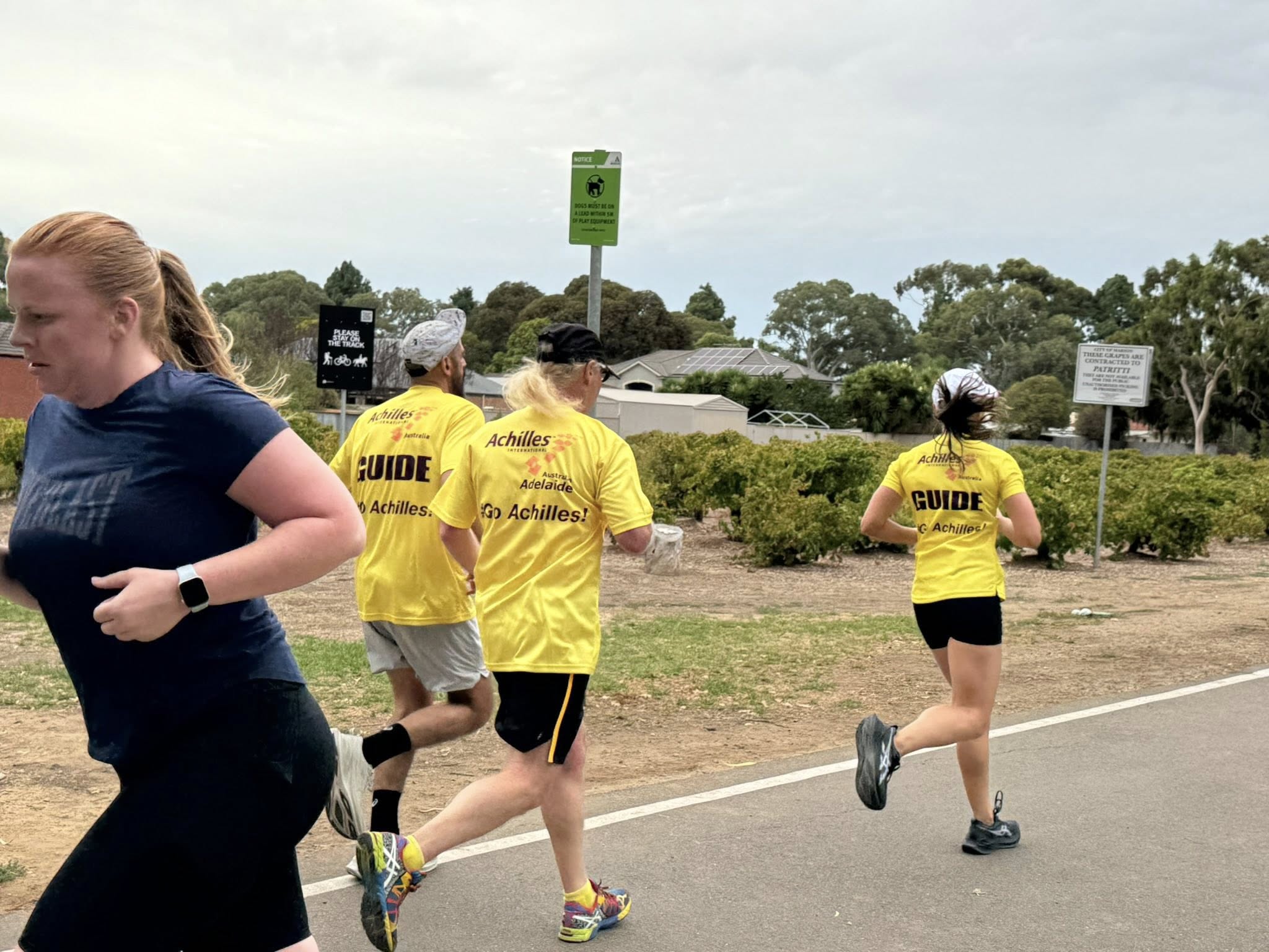 Che Warren and Bruna teaming up to smash out a park run